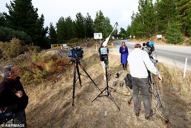 Media can be seen outside the mine entrance, which is not open to the public