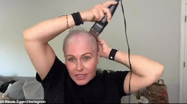 Nicole Eggert shaved her head in a new video shared with her more than 143,000 Instagram followers on Thursday amid her battle with breast cancer