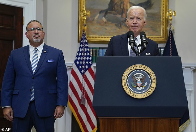 Education Secretary Miguel Cardona stands next to President Biden at the White House after the Supreme Court blocked the president's original $400 billion student loan forgiveness plan