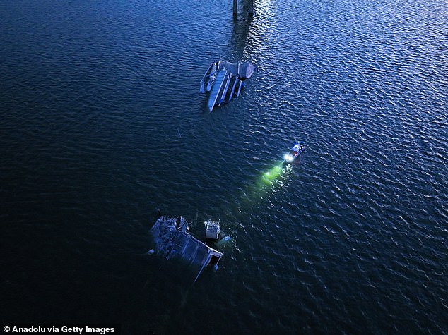 An aerial view of the collapsed Francis Scott Key Bridge after the collision