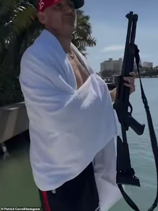 Patrick Carroll, wearing a red Make America Great Again hat and white towel, shared and deleted a video of himself firing a shotgun from the back of a yacht