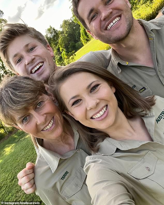 Bindi Irwin shared a heartfelt message on Instagram with her loving 'Khaki crew' family – mother Terri, brother Robert and husband Chandler Powell (all pictured)