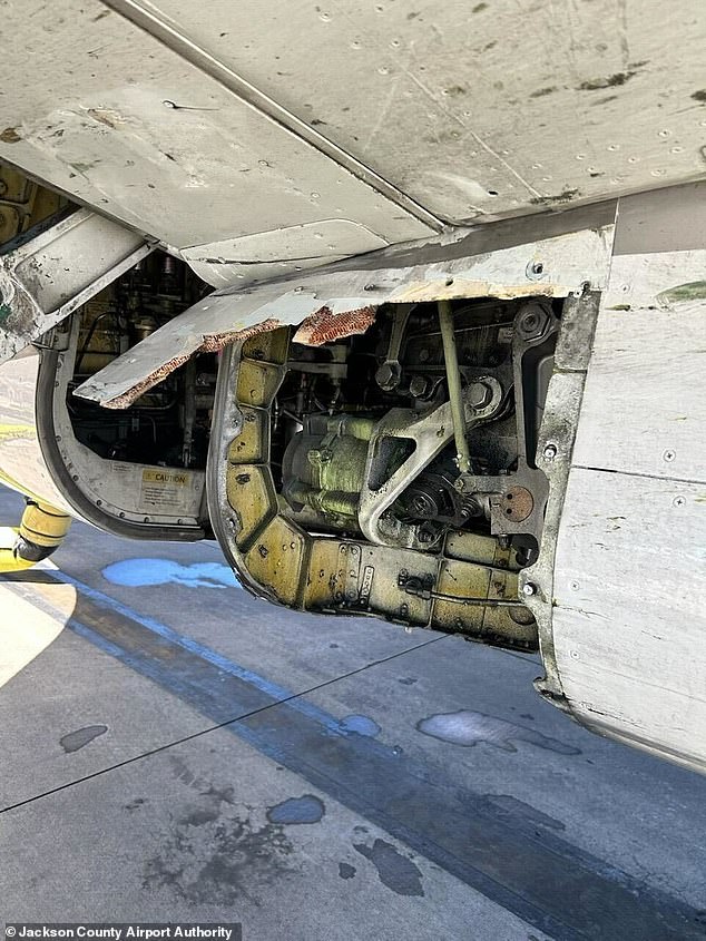 A Boeing-built United Airlines plane was grounded Friday after it was found to be missing a panel after landing after a flight.  In the photo: the missing part of the 25-year-old Boeing 737-824