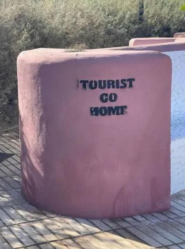 'TOURIST GO HOME': Graffiti has appeared in the Canary Islands telling tourists to 'go home' and accusing holidaymakers of causing 'misery' to locals