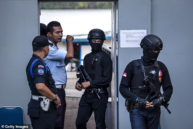 Prisoners are usually executed by firing squad.  Pictured: Indonesian police at Nusakambangan Prison as Indonesia prepared for drug executions in July 2016