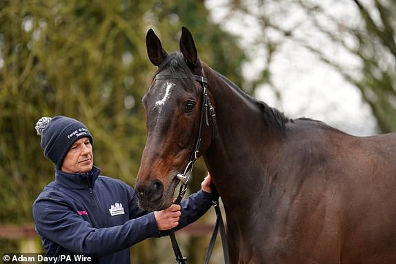 A groom with Dysart Enos during a visit to Fergal O'Brien's garden at Ravenswell Farm, Withington.  Date of photo: Tuesday, February 27, 2024. PA Photo.  See PA story RACING O'Brien.  Photo credit should read: Adam Davy/PA Wire.  RESTRICTIONS: Use subject to restrictions.  Editorial use only, no commercial use without prior permission from the rights holder.