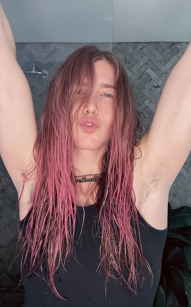 In exclusive photos obtained by Daily Mail Australia, Christian dyed his long hair pink for the LGBTQI+ pride event in Sydney