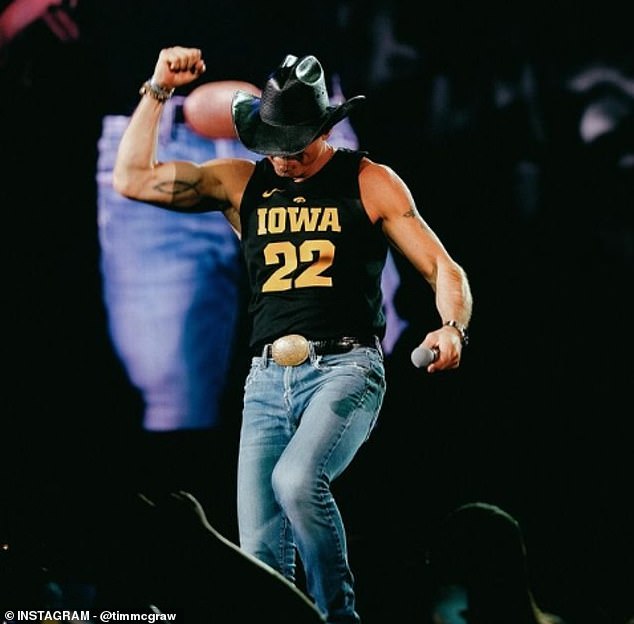 Country music icon Tim McGraw wore a Caitlin Clark sweater during his show in Des Moines