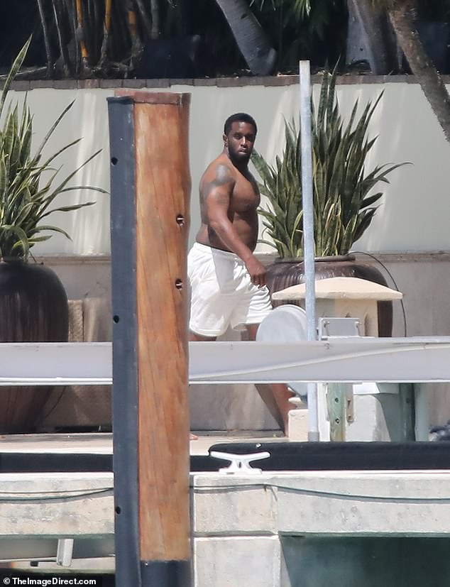 Diddy looked carefree as he stepped out for a smoke and a walk along the pier outside his Miami mansion just days after the FBI's sex trafficking raids