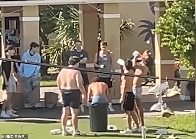 A disturbing video shows a hazing incident at the University of Miami where members of a fraternity drank milk before spitting it on the bare back of a student sitting in a garbage can