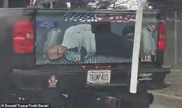 Former President Donald Trump posted a video to social media showing the image of a tied-up President Joe Biden painted on the tailgate of a passing truck