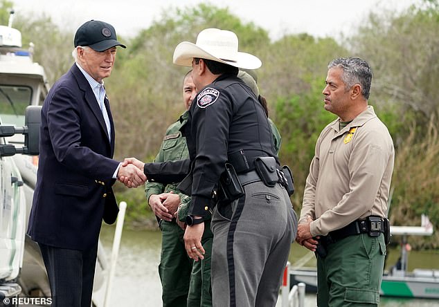 U.S. President Joe Biden greets a member of law enforcement as he receives a briefing at the U.S.-Mexico border in Brownsville, Texas, on February 29.