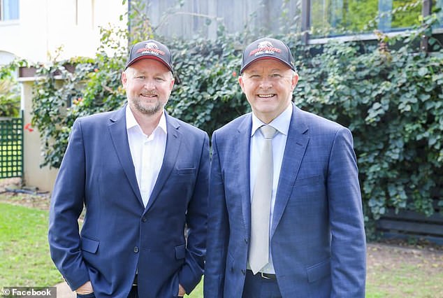 Mr Denton, pictured running for the federal seat of Petrie, campaigning with then opposition leader Anthony Albanese