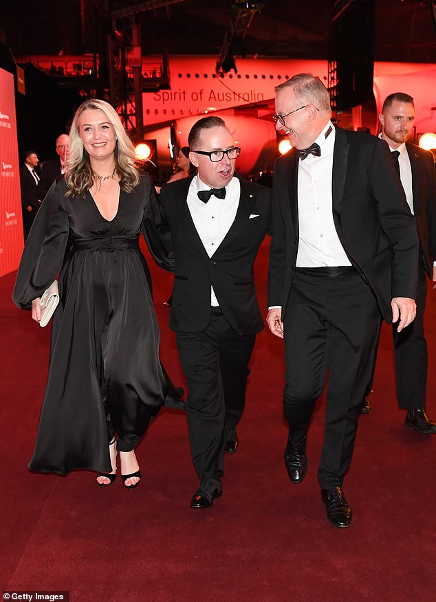 Alan Joyce resigned as Qantas boss last September.  He is pictured with Anthony Albanese (right) and Mr Albanese's partner, Jodie Haydon (left)