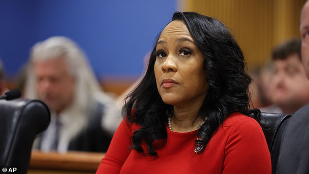 Scandal-plagued Fulton County District Attorney Fani Willis could already be kicked off the case over her relationship with a lawyer she hired to help run the case (pictured during hearings this week)