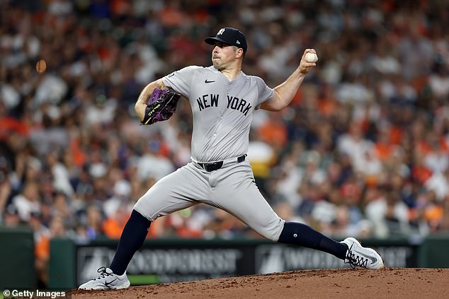 Rodon's sweat is clearly visible through various parts of his jersey against Houston