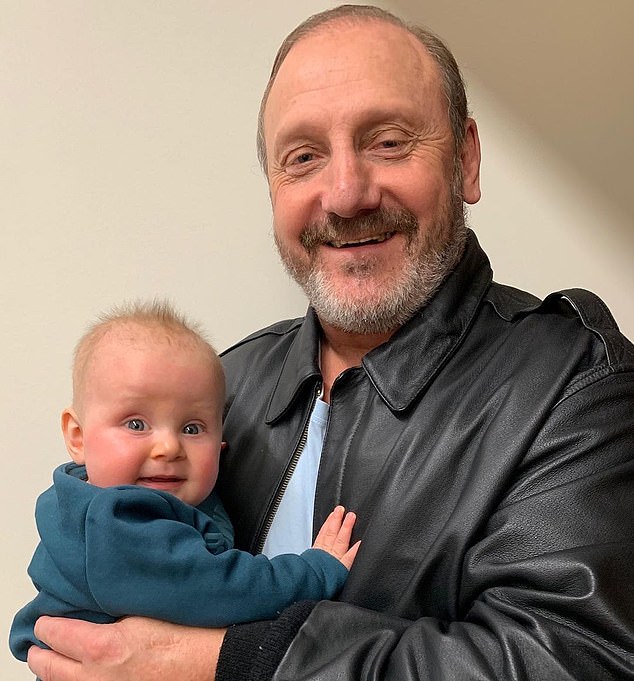 The man many fans call God (pictured with his grandson Levi) has fallen on hard times financially after his life-changing diagnosis