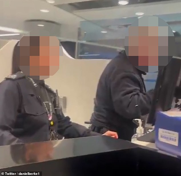 Footage shows a male border guard officer (right) speaking in 'aggressive terms' to two Israeli men who had traveled to Britain to raise awareness about terrorism