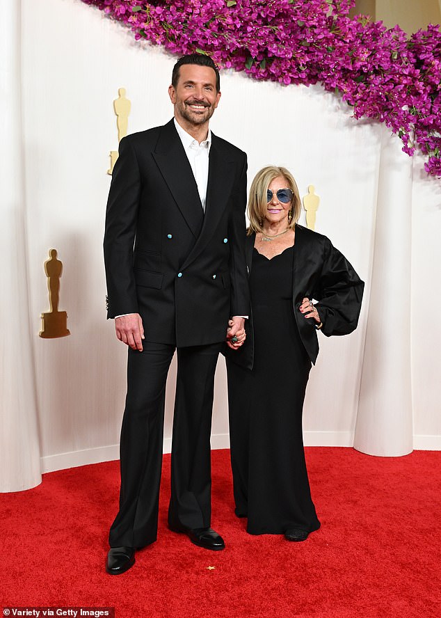 This comes after a source told Us Weekly that Gigi didn't walk the red carpet with boyfriend Bradley Cooper at the Vanity Fair Oscar party as planned because she had to fly back to New York City for work at the last minute.  Seen with his mother at the Oscars