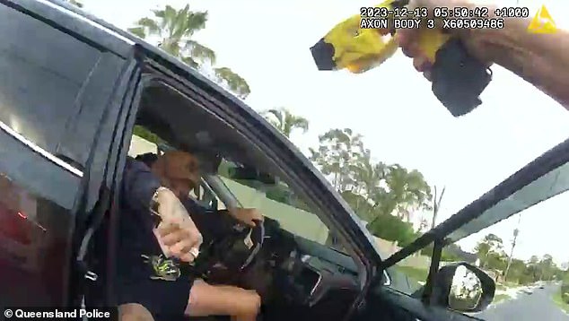 Wild footage has emerged of the moment Noah Spells, 40, jumped out of a car to attack a female officer (pictured) in Pagewood, Gold Coast, on December 13.