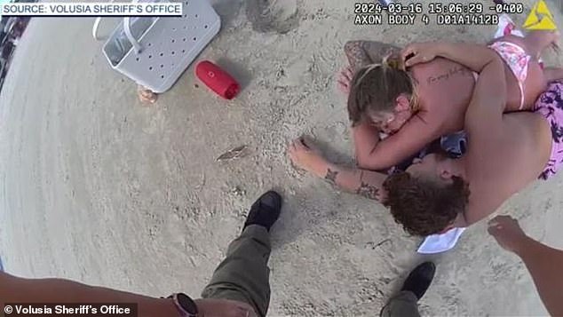 A Georgia couple passed out drunk on a beach in Daytona, Florida, when they were arrested for child negligence, police say