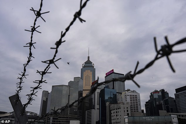 Hong Kong lawmakers are accused of rushing through an 'authoritarian' bill that would impose life sentences on 'traitors' and 'public enemies'