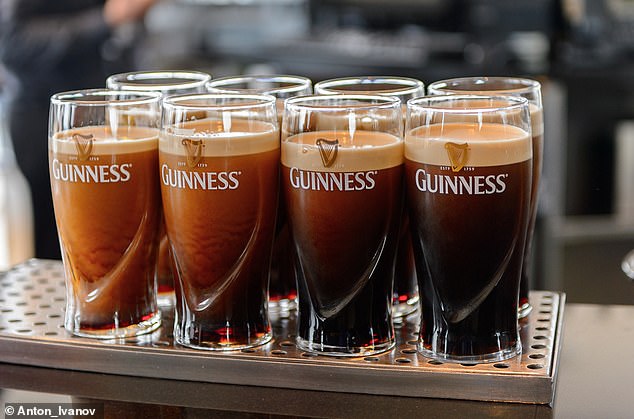 Pubgoers will be used to waiting ages for their beloved Guinness while the bar staff perform the 'famous' two-part pour.  Pictured: Glasses of Guinness prior to the second part of the two-part pour