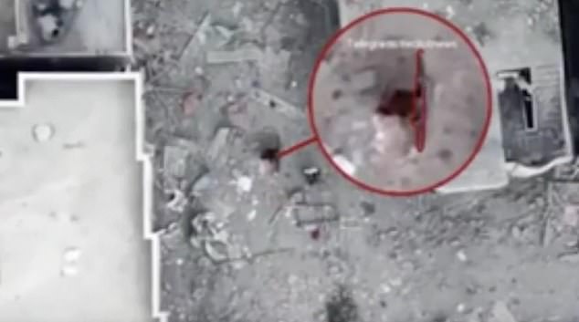 Footage released by the Israeli military zooms in on one of the figures, with a caption falsely claiming they are carrying an RPG