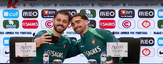 Bernardo Silva (left) posed for a selfie with Portuguese teammate Jota Silva (right) during their press conference today