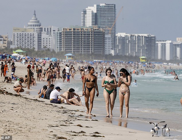 Spring break is off to a quiet start in Miami as beachgoers say there are 'more police than people' amid a crackdown on out-of-control parties