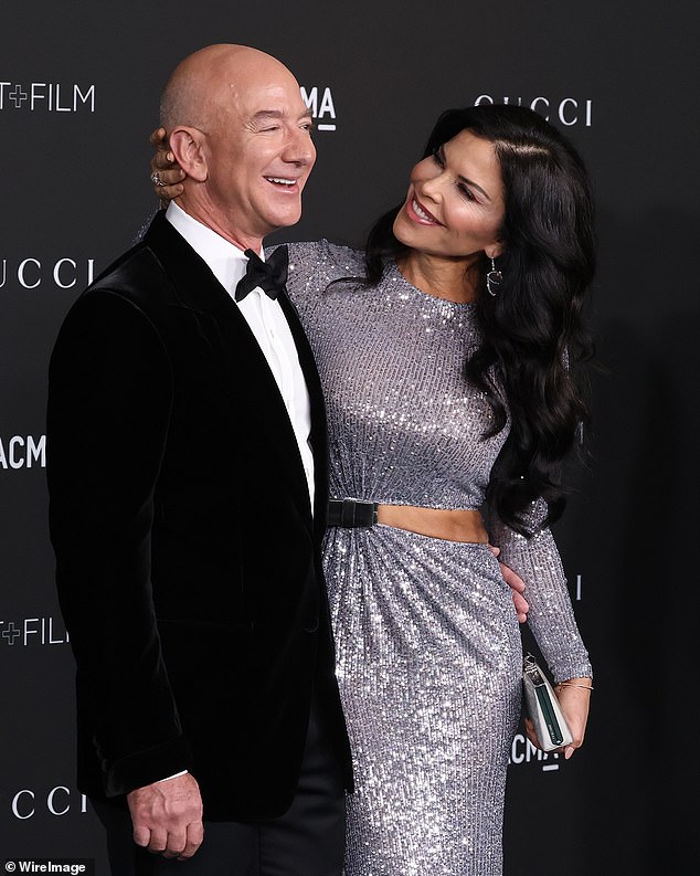 Jeff Bezos has returned to the top of the world's richest people list for the first time in three years, as his largesse reaches $200 billion and former number one Elon Musk's wealth stumbles.  Bezos is pictured sharing the red carpet with Lauren Sanchez