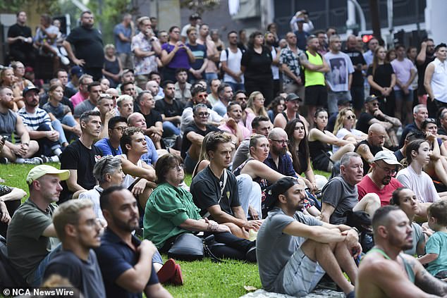 Friends and family gathered (pictured) to hold a silent vigil in Sydney for Jesse Baird and Luke Davies