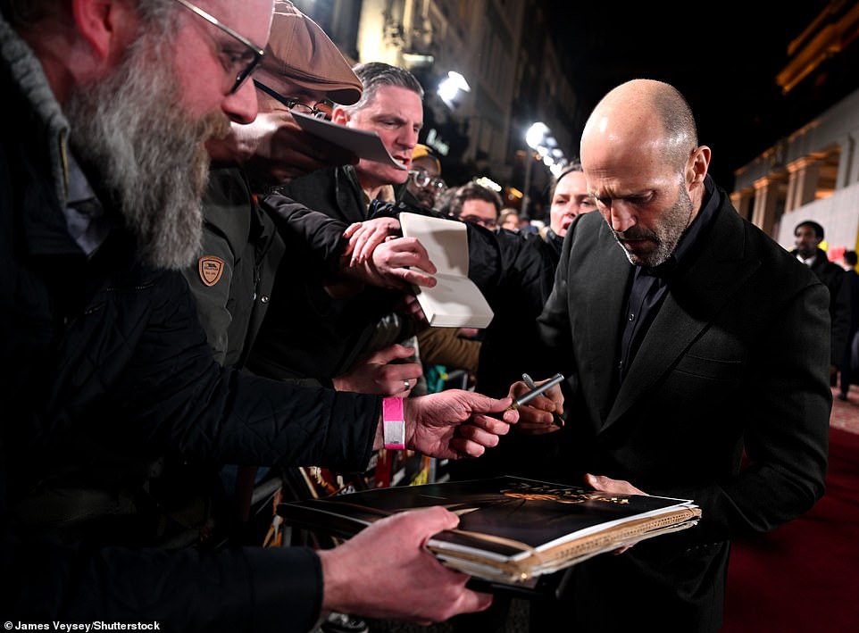 The action star signed autographs for fans on the red carpet