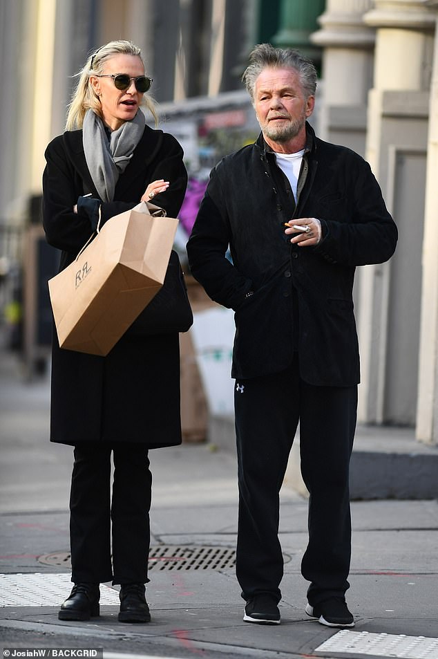 John Mellencamp, 72, took a smoke break Friday while shopping with his girlfriend Kristin Kehrberg, 57, in Downtown Manhattan's Soho neighborhood