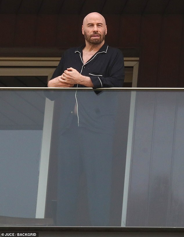 John Travolta was spotted on his balcony in Ipanema in Rio de Janeiro, Brazil on Saturday morning.  The actor, 70, looked cozy and comfortable in black pajamas as he took in the sights and sounds of the tropical paradise's beachside neighborhood in the morning.