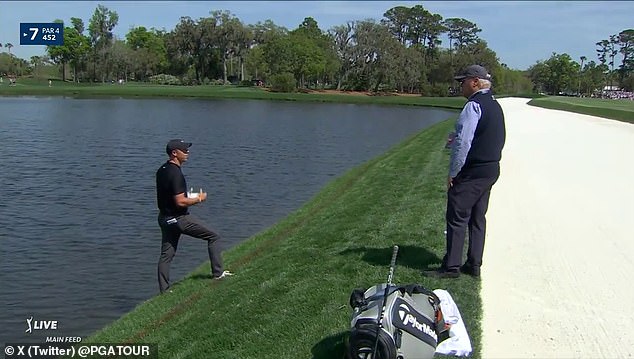 Rory McIlroy hit a drive into the water on the seventh hole, leading to a lengthy delay