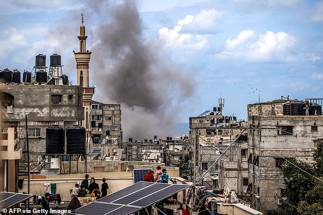 A plume of smoke erupts during the Israeli bombardment of a building in Rafah in the southern Gaza Strip on March 24, 2024