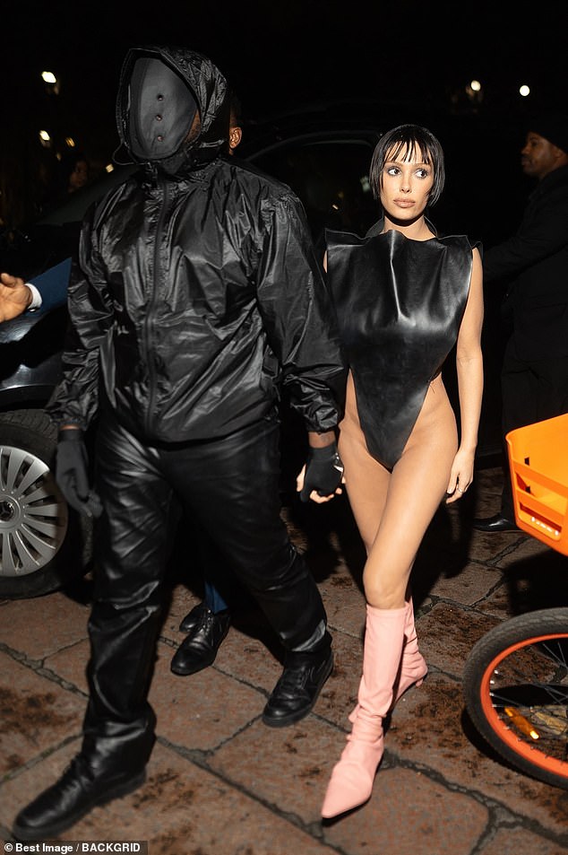 Kanye West and his wife Bianca Censori often raise eyebrows when they appear in public together because of her very racy outfits.  Now an insider has claimed that the rapper, who has demanded the music industry call him 'Ye', is doing so for a reason.  Pictured in Milan in February