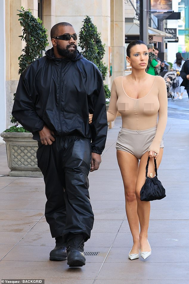 Kanye West's wife Bianca Censori showed off her assets in another stunning ensemble as she joined the rapper at the Cheesecake Factory in LA on Wednesday