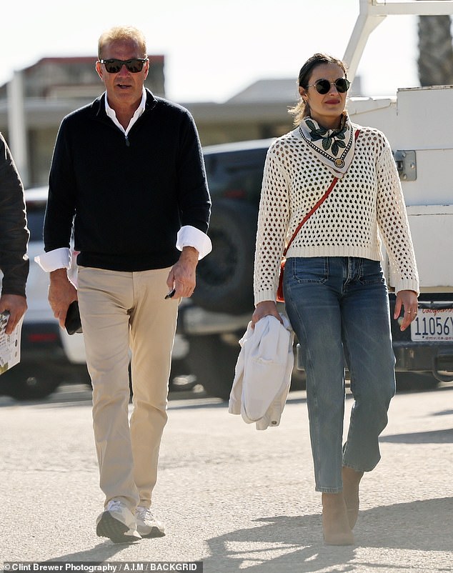 Dressed in a casual V-neck sweater and khaki pants, the actor stayed close to his female companion as he left The Boathouse restaurant.