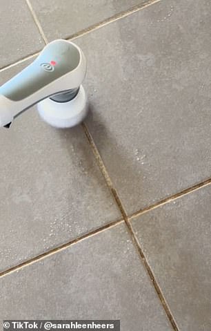 Sarah Leenheers from Melbourne used Kmart's long handled scrub brush to clean her dirty tiles (pictured)