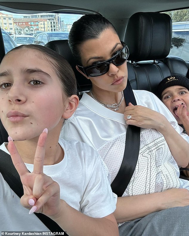 Kourtney Kardashian shared sweet snaps from her two-week family trip to Sydney, Australia on Thursday (pictured with daughter Penelope, 11, and son Reign, eight)
