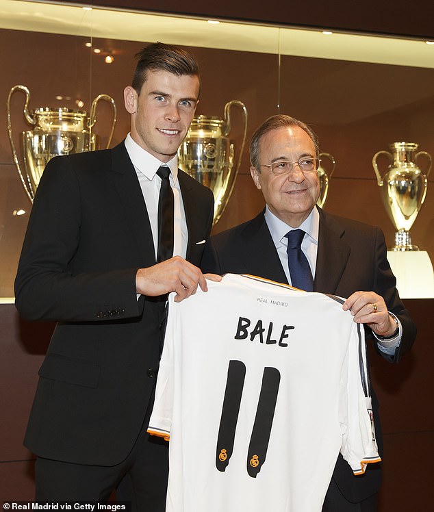 Bale is welcomed to Real Madrid by their president Florentino Perez in 2013