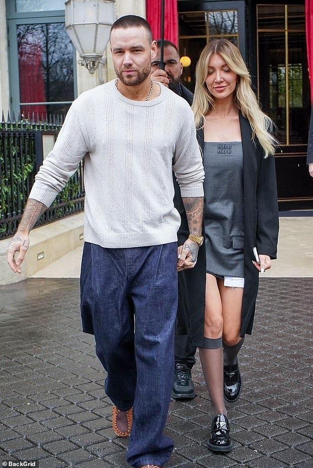 Liam Payne put on a loving show with his girlfriend Katie Cassidy as they headed out for lunch in Paris on Saturday