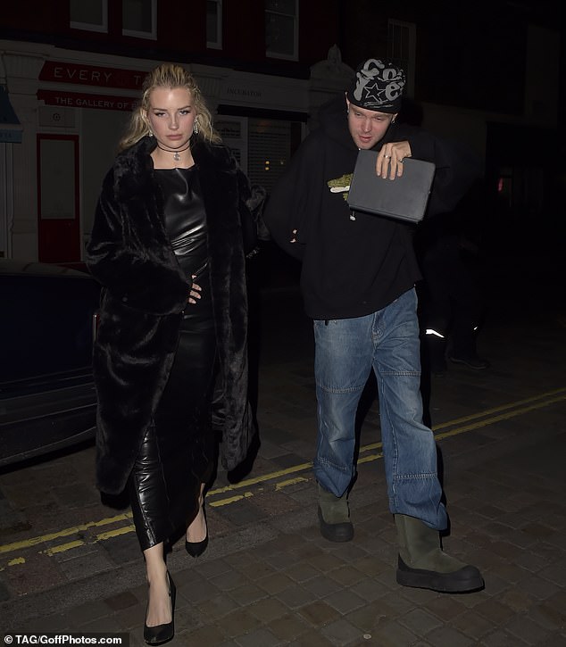 Lottie Moss, 26, put on a chic performance as she arrived with a mystery man at Chiltern Firehouse in London on Wednesday evening