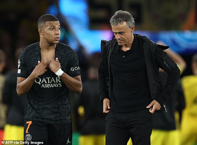 Kylian Mbappe and Luis Enrique (right) have reportedly held clear talks after the PSG coach dropped the striker early in their last two games