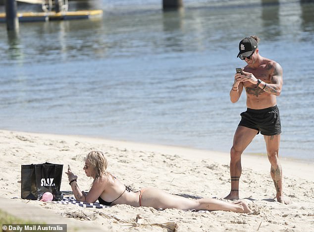 Married At First Sight groom Jack Dunkley was spotted taking racy photos of his bride Tori Adams' bum during a beach date on the Gold Coast on Wednesday