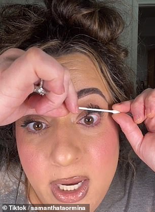 She moved the center of the cotton swab all the way around her lash line