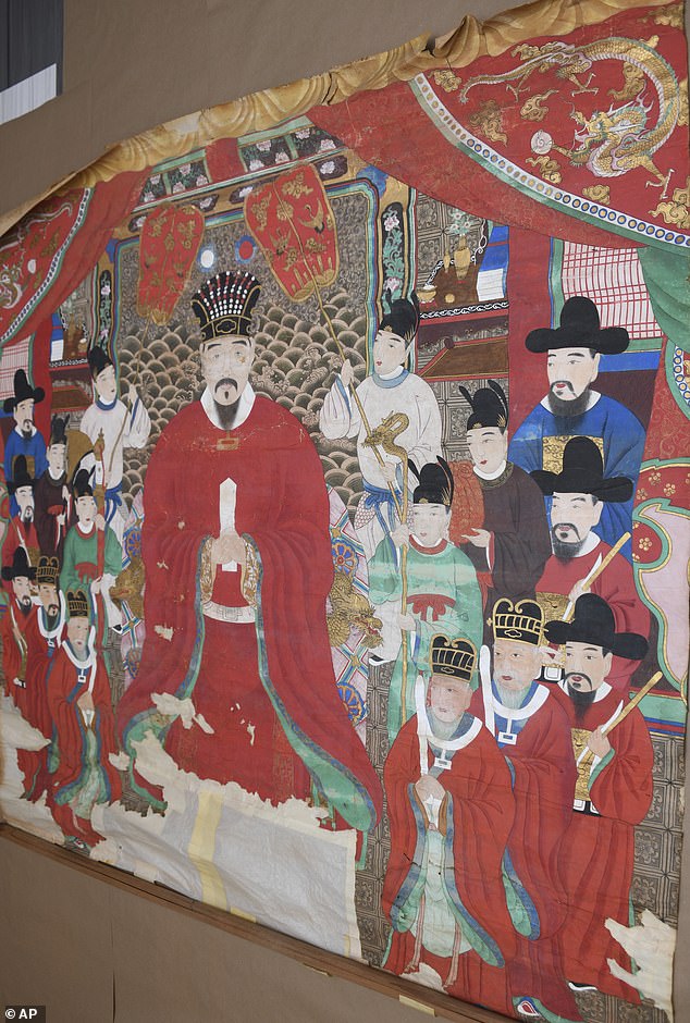 More than two dozen artifacts looted after the Battle of Okinawa in World War II have been returned to Japan, including this tapestry depicting the Okinawan royal family