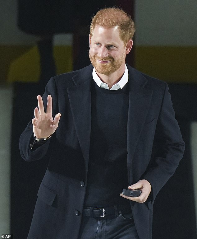 The Duke of Sussex waves to the crowd as he arrives to drop the puck for a ceremonial face-off during an NHL ice hockey game in Vancouver last year